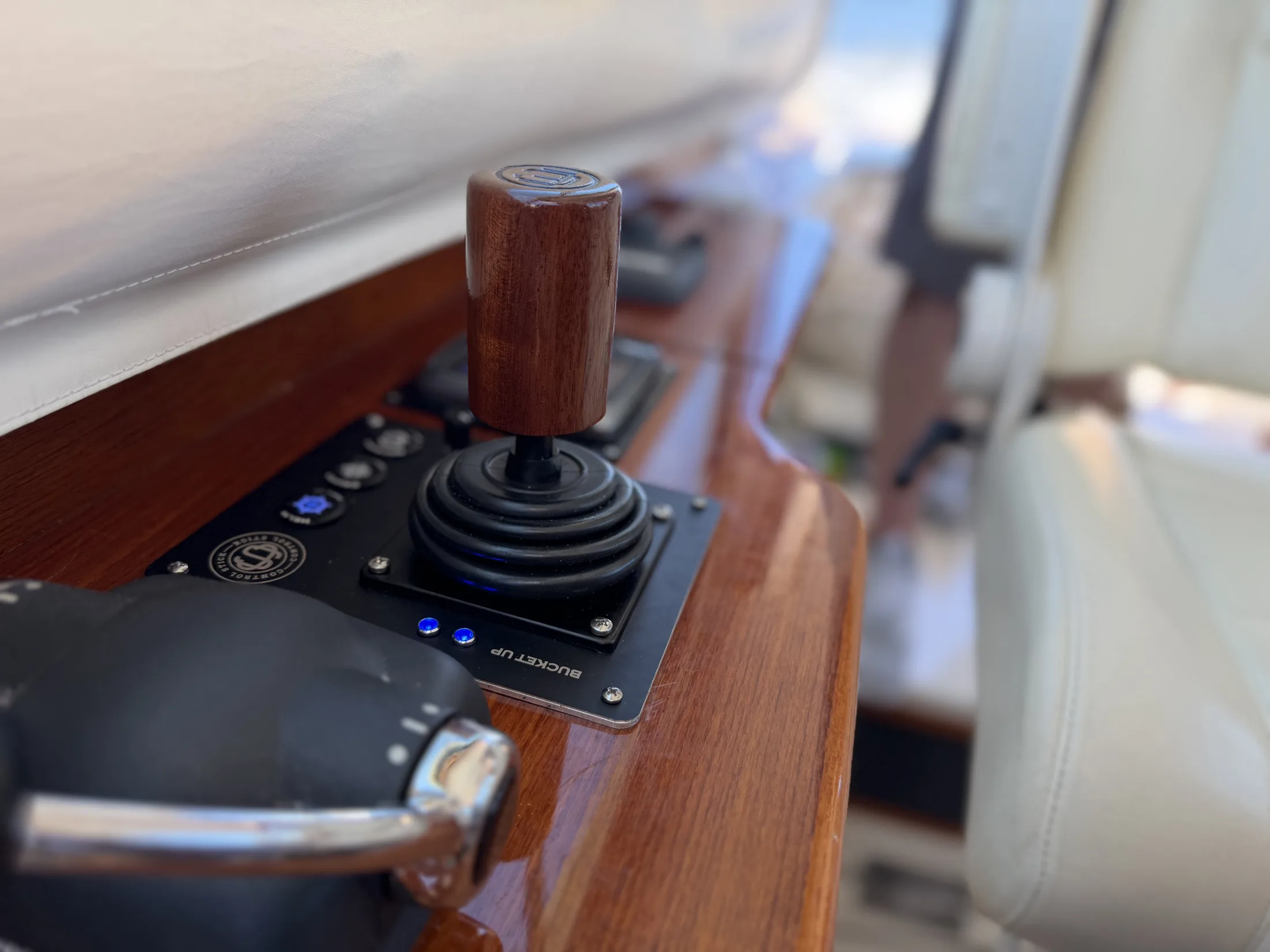 Hamilton Jet controls in a varnished teak helm